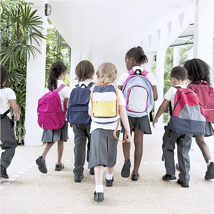 Kids entering school wearing uniforms with pride - representation and inclusivity
